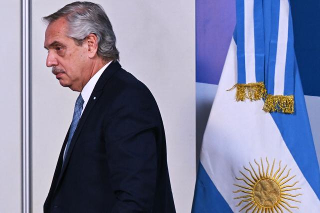 (FILES) Argentine President Alberto Fernandez arrives to a press conference in the framework of the Summit of Heads of State of MERCOSUR and Associated States in Puerto Iguazu, Argentina on July 4, 2023. An Argentine judge on July 10, 2025, ordered ex-president Alberto Fernandez to stand trial for alleged corruption relating to insurance policies taken out by government departments during his 2019-2023 term. Fernandez, 66, will be prosecuted for "negotiations incompatible with the exercise of public office," according to the judge's ruling published in local media and confirmed by defense lawyer Mariana Barbitta. (Photo by NELSON ALMEIDA / AFP)
