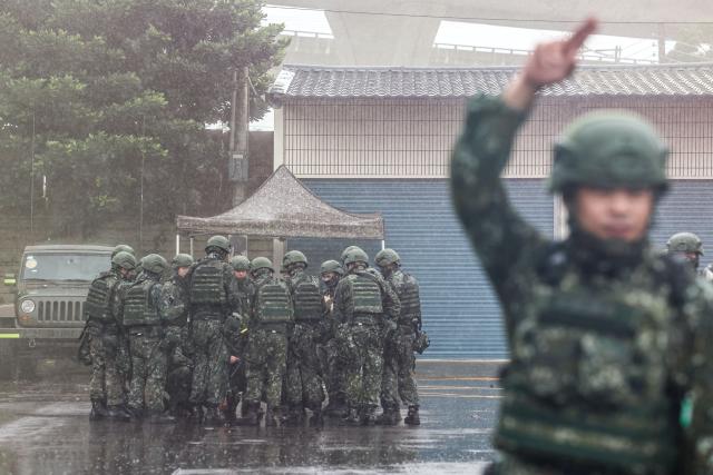 Taiwanese reservists take part in a pre-combat training during Taiwan's annual Han Kuang military exercise in Taoyuan on July 11, 2025. (Photo by I-Hwa Cheng / AFP)