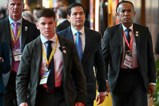 US Secretary of State Marco Rubio (C) walks between meetings during the 58th ASEAN Foreign Ministers' meeting and related meetings at the Convention Centre in Kuala Lumpur on July 11, 2025. (Photo by Mandel NGAN / POOL / AFP)