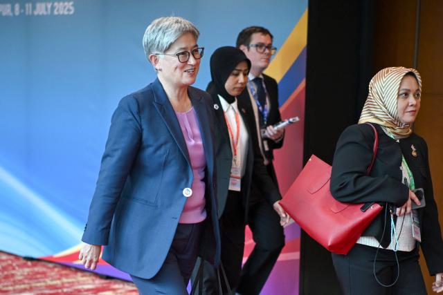 Australia's Minister for Foreign Affairs Penny Wong (L) walks between meetings during the 58th ASEAN Foreign Ministers' meeting and related meetings at the Convention Centre in Kuala Lumpur on July 11, 2025. (Photo by Mandel NGAN / POOL / AFP)
