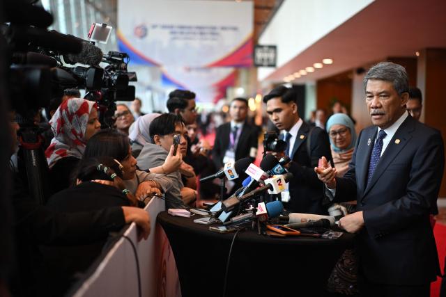 Malaysia's Foreign Affairs Minister Mohamad Hasan (R) takes part in a press briefing during the 58th ASEAN Foreign Ministers' meeting and related meetings at the Convention Centre in Kuala Lumpur on July 11, 2025. (Photo by Mandel NGAN / POOL / AFP)