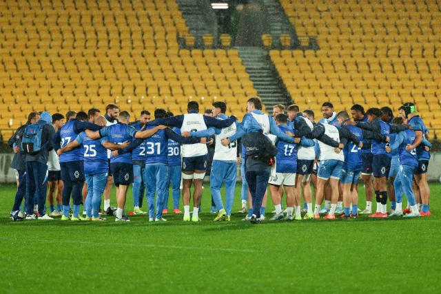 France players huddle during the captain's run ahead of the second international rugby Test match against New Zealand, at Sky Stadium in Wellington on July 11, 2025. (Photo by Marty MELVILLE / AFP)
