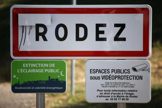 This photograph shows a road sign at the entrance of the town of Rodez, southern France, on July 10, 2025. (Photo by Valentine CHAPUIS / AFP)