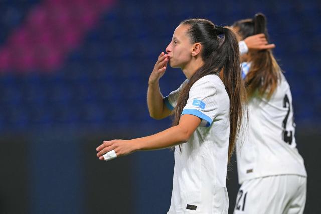 Uruguay's forward #10 Belen Aquino celebrates after scoring during the Women's Copa America 2025 football match between Ecuador and Uruguay at the IDV Stadium in Quito on July 11, 2025. (Photo by Rodrigo BUENDIA / AFP)