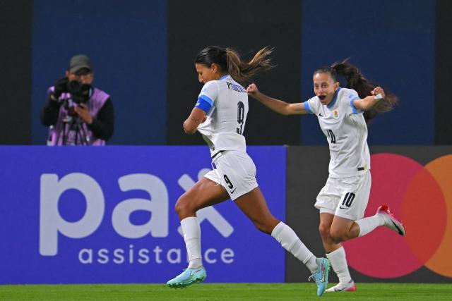 Uruguay's midfielder #09 Cinthia Gonzalez celebrates with teammate forward #10 Belen Aquino after scoring during the Women's Copa America 2025 football match between Ecuador and Uruguay at the IDV Stadium in Quito on July 11, 2025. (Photo by Rodrigo BUENDIA / AFP)