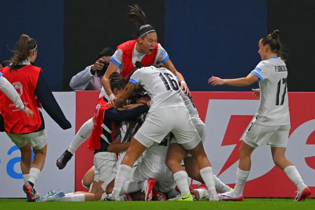 Uruguay's midfielder #09 Cinthia Gonzalez (unseen) celebrates with teammates after scoring during the Women's Copa America 2025 football match between Ecuador and Uruguay at the IDV Stadium in Quito on July 11, 2025. (Photo by Rodrigo BUENDIA / AFP)