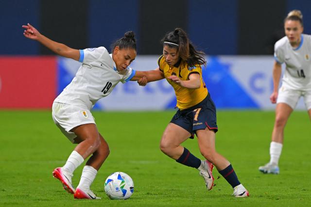 Uruguay's forward #19 Wendy Carballo and Ecuador's forward #07 Emily Arias fight for the ball during the Women's Copa America 2025 football match between Ecuador and Uruguay at the IDV Stadium in Quito on July 11, 2025. (Photo by Rodrigo BUENDIA / AFP)