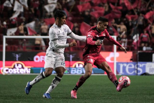 Tijuana's defender #16 Jesus Vega (R) fights for the ball with Queretaro's Mexican defender #12 Jaime Gomez during the Liga MX Clausura football tournament match between Tijuana and Queretaro at Caliente Stadium in Tijuana, Baja California State, Mexico, on July 11, 2025. (Photo by Guillermo Arias / AFP)
