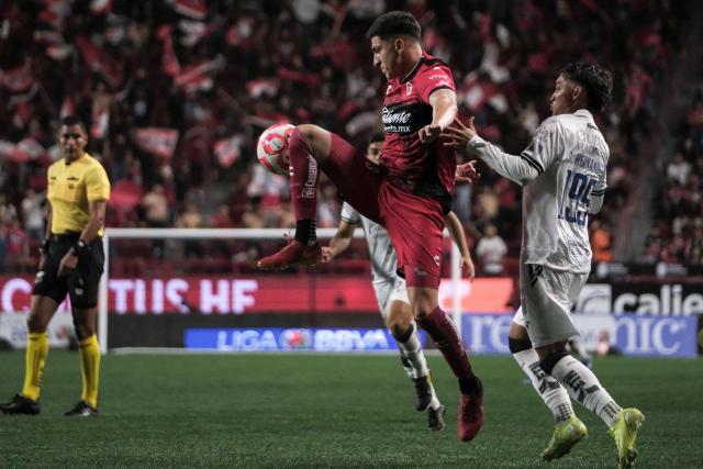Tijuana's #03 Mexican defender Rafael Fernandez fights for the ball with Queretaro's Colombian midfielder #199 Sebastian Hernandez during the Liga MX Clausura football tournament match between Tijuana and Queretaro at Caliente Stadium in Tijuana, Baja California State, Mexico, on July 11, 2025. (Photo by Guillermo Arias / AFP)