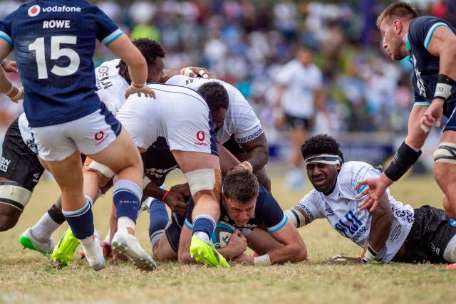 Scotland's Fergus Burke is tackled by Fiji defence during the rugby test match between Fiji and Scotland at HFC Bank Stadium in Suva on July 12, 2025. (Photo by Josua BUREDUA / AFP)