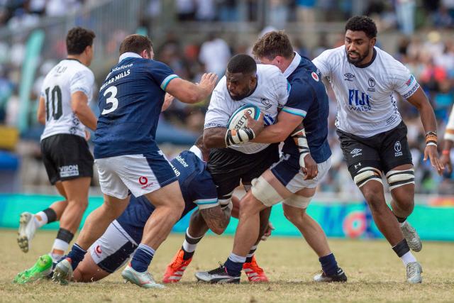 Fiji's Temo Mayanavanua evades a tackle from Scotland's defense during the rugby test match between Fiji and Scotland at HFC Bank Stadium in Suva on July 12, 2025. (Photo by Josua BUREDUA / AFP)