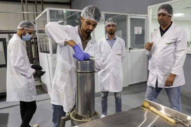 Workers man a station at Biocannat, a cannabis processing factory in Bab Berred, southeast of Morocco's rural northern province of Chefchaouen, on July 11, 2025. Morocco passed a law in 2021 allowing the cultivation of medical and industrial-use cannabis in areas of Rif, a mountainous region that has long been a major source of illicit hashish, a stronger derivative of cannabis, smuggled to Europe. (Photo by Abdel Majid BZIOUAT / AFP)