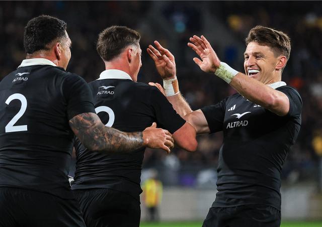 New Zealand's Cam Roigard (C) celebrates his first try with Beauden Barrett (R) during the second international rugby test match between New Zealand and France at Sky Stadium in Wellington on July 12, 2025. (Photo by Grant Down / AFP)