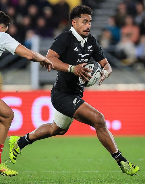 New Zealand's Emoni Narawa runs the ball during the second international rugby test match between New Zealand and France at Sky Stadium in Wellington on July 12, 2025. (Photo by Grant Down / AFP)