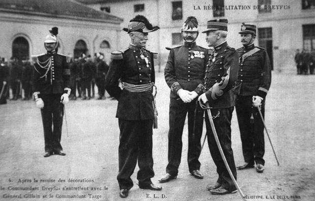(FILES) Captain Alfred Dreyfus (2R) speaks with General Gillain (L) who has just awarded him the Legion of Honor during a ceremony celebrating Dreyfus' rehabilitation, in the large courtyard of the Military School in Paris on July 21, 1906. France's President Emmanuel Macron on July 12, 2025, has established a national day of commemoration, for the rehabilitation by justice of Alfred Dreyfus, a Jewish officer unjustly accused of treason at the end of the 19th century, calling for "always" remaining vigilant "against the old demons" of anti-Semitism. (Photo by AFP)