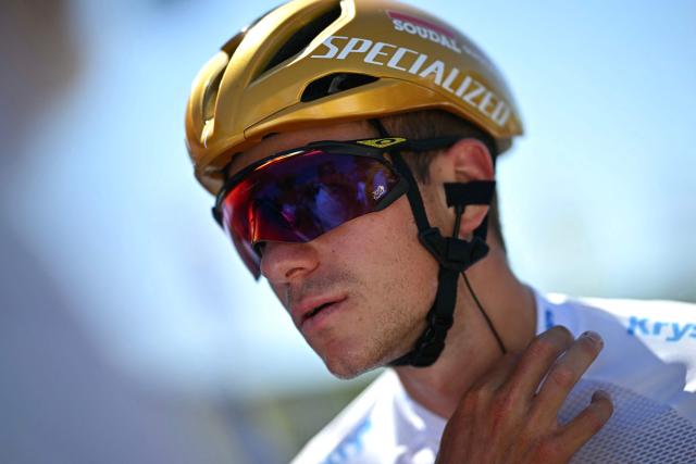 Soudal Quick-Step team's Belgian rider Remco Evenepoel awaits the start of the 8th stage of the 112th edition of the Tour de France cycling race, 171.4 km between Saint-Meen-le-Grand and Laval Espace Mayenne, western France, on July 12, 2025. (Photo by Loic VENANCE / AFP)