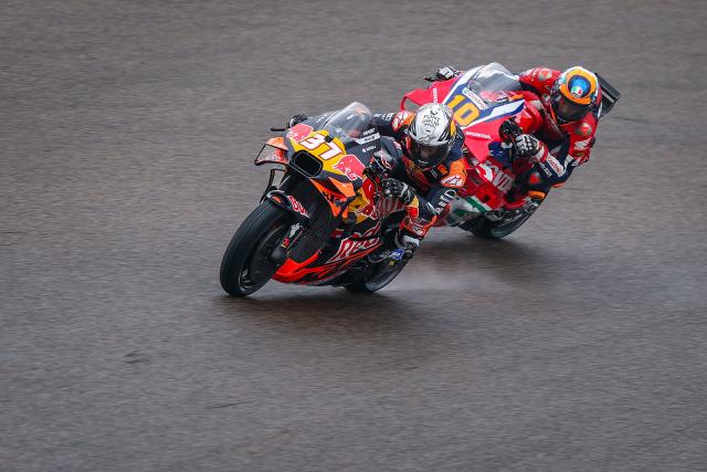 Red Bull KTM Factory Racing team's Spanish MotoGP rider Pedro Acosta (L) and Honda HRC Castrol team's Italian MotoGP rider Luca Marini steer their bikes during the third practice session of the MotoGP German motorcycle Grand Prix at the Sachsenring racing circuit, in Hohenstein-Ernstthal near Chemnitz, eastern Germany on July 12, 2025. (Photo by Ronny Hartmann / AFP)