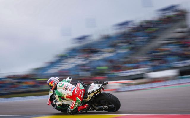 Aprilia Racing team's Italian MotoGP rider Marco Bezzecchi steers his bike during the third practice session of the MotoGP German motorcycle Grand Prix at the Sachsenring racing circuit, in Hohenstein-Ernstthal near Chemnitz, eastern Germany on July 12, 2025. (Photo by Ronny Hartmann / AFP)