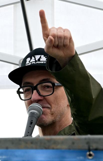 German DJ Dr Motte gestures as he greets participants during the "Rave The Planet" electronic music parade titled "Our Future is Now" in Berlin on July 12, 2025 in Berlin. (Photo by Tobias SCHWARZ / AFP)