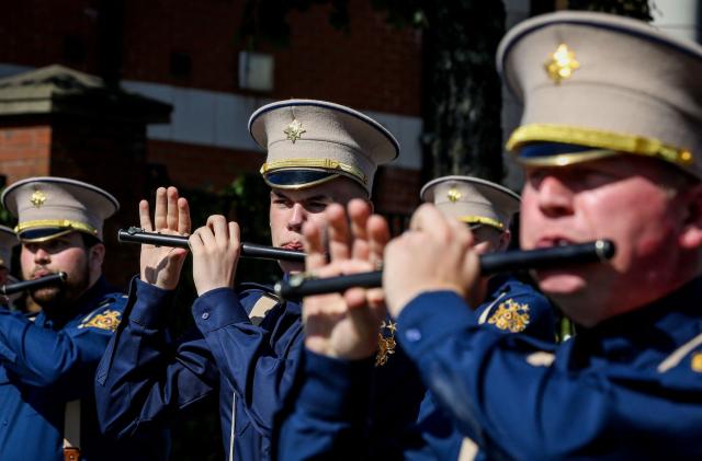 A band joins members of Orange Order as they take part in a parade in Belfast on July 12, 2025, to celebrate the battle of the Boyne in 1690, when the Protestant King William of Orange defeated the Catholic King James. (Photo by PAUL FAITH / AFP)