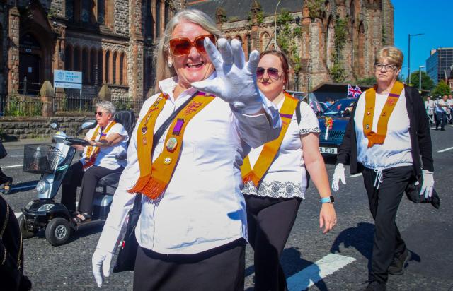 Members of Orange Order take part in a parade in Belfast on July 12, 2025, to celebrate the battle of the Boyne in 1690, when the Protestant King William of Orange defeated the Catholic King James. (Photo by PAUL FAITH / AFP)
