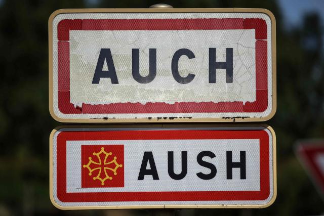 This photograph shows road signs at the entrance of the town of Auch, southwestern France, on July 11, 2025. (Photo by Valentine CHAPUIS / AFP)