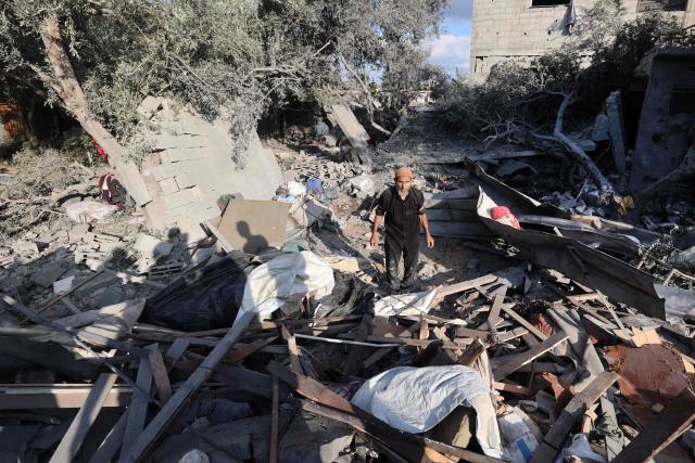 A Palestinian man checks the damage in the aftermath of an overnight Israeli strike that hit Nuseirat in the central Gaza Strip on July 13, 2025. (Photo by Eyad BABA / AFP)