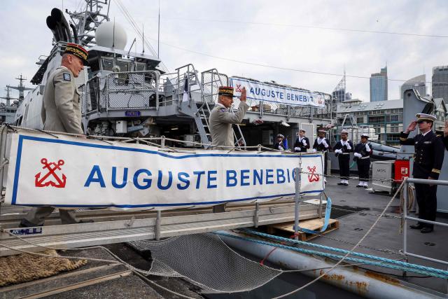 Commander of French Forces New Caledonia Major General Yann Latil (C) gestures as he comes aboard the French patrol vessel Auguste Benebig, which will participate in the annual Talisman Sabre exercise, in Sydney on July 13, 2025. More than 30,000 military personnel from 19 nations are set to join in the annual Talisman Sabre exercise from Sunday across Australia and Papua New Guinea. (Photo by DAVID GRAY / AFP)