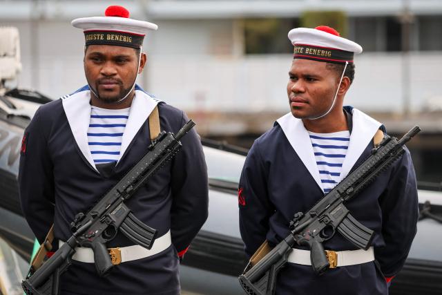 French sailors wearing navy ceremonial uniforms, participate in an event on the deck of the French patrol vessel Auguste Benebig, which will participate in the annual Talisman Sabre exercise, in Sydney on July 13, 2025. More than 30,000 military personnel from 19 nations are set to join in the annual Talisman Sabre exercise from Sunday across Australia and Papua New Guinea. (Photo by DAVID GRAY / AFP)
