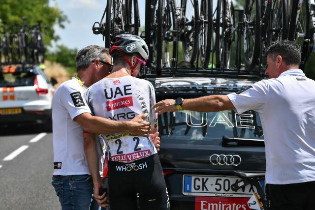 UAE Team Emirates - XRG team's Portuguese rider Joao Almeida boards his team support vehicle as he withdraws from the race on injury, during the 9th stage of the 112th edition of the Tour de France cycling race, 174.1 km between Chinon and Chateauroux, central France, on July 13, 2025. (Photo by Marco BERTORELLO / AFP)