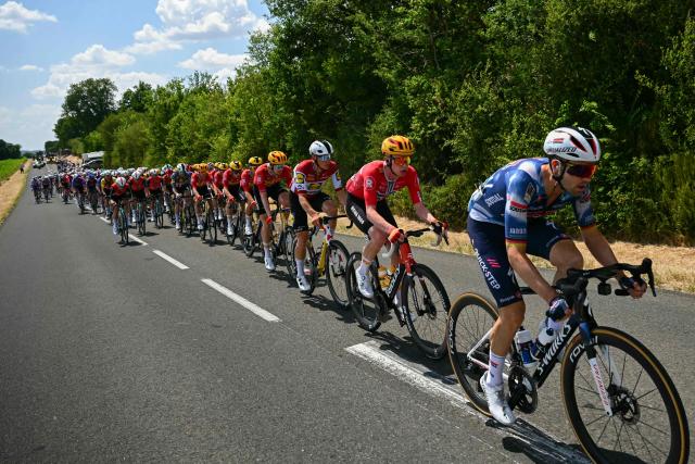 Soudal Quick-Step team's German rider Maximilian Schachmann leads the pack of riders (peloton) during the 9th stage of the 112th edition of the Tour de France cycling race, 174.1 km between Chinon and Chateauroux, central France, on July 13, 2025. (Photo by Loic VENANCE / AFP)