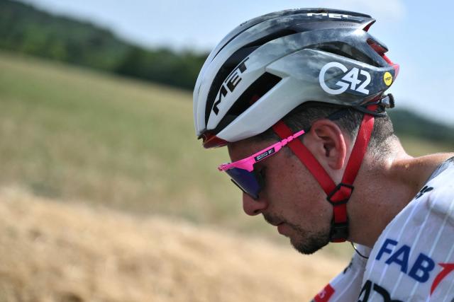 UAE Team Emirates - XRG team's Portuguese rider Joao Almeida boards his team support vehicle as he withdrawing from the race on injury, during the 9th stage of the 112th edition of the Tour de France cycling race, 174.1 km between Chinon and Chateauroux, central France, on July 13, 2025. (Photo by Marco BERTORELLO / AFP)