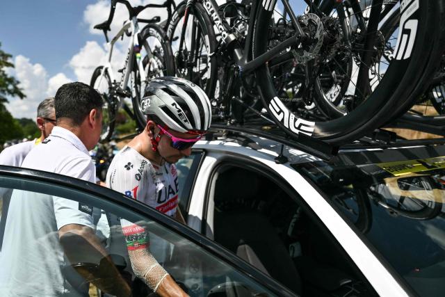 UAE Team Emirates - XRG team's Portuguese rider Joao Almeida boards his team support vehicle as he withdraws from the race on injury, during the 9th stage of the 112th edition of the Tour de France cycling race, 174.1 km between Chinon and Chateauroux, central France, on July 13, 2025. (Photo by Marco BERTORELLO / AFP)