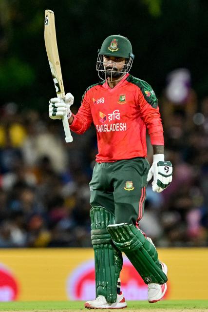 Bangladesh's captain Litton Das celebrates after scoring a half-century (50 runs) during the second Twenty20 international cricket match between Sri Lanka and Bangladesh at the Rangiri Dambulla International Stadium in Dambulla on July 13, 2025. (Photo by Ishara S. KODIKARA / AFP)