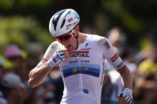 Soudal Quick-Step team's Belgian rider Tim Merlier cycles to the finish line to win the 9th stage of the 112th edition of the Tour de France cycling race, 174.1 km between Chinon and Chateauroux, central France, on July 13, 2025. (Photo by Anne-Christine POUJOULAT / AFP)