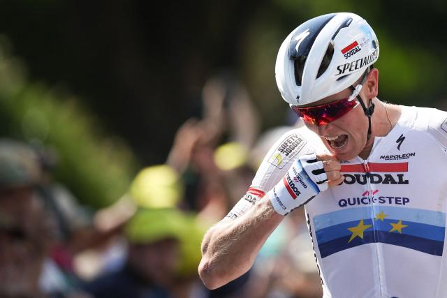 Soudal Quick-Step team's Belgian rider Tim Merlier cycles to the finish line to win the 9th stage of the 112th edition of the Tour de France cycling race, 174.1 km between Chinon and Chateauroux, central France, on July 13, 2025. (Photo by Anne-Christine POUJOULAT / AFP)