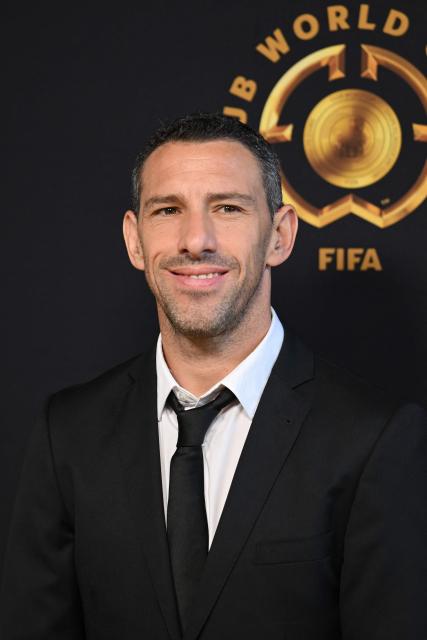 Argentinian former footyball player Maxi Rodriguez poses on the Golden Carpet upon arrival for the FIFA Club World Cup 2025 final football match between England's Chelsea and France's Paris Saint-Germain at the MetLife Stadium in East Rutherford, New Jersey on July 13, 2025. (Photo by ANGELA WEISS / AFP)