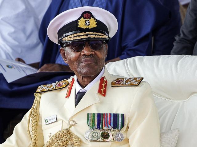 (FILES) Outgoing Nigerian President Muhammadu Buhari looks on at the presidential fleet review held at the Naval Dockyard in Lagos on May 22, 2023. Former Nigerian president Muhammadu Buhari -- who led his country first as a military strongman and later as an elected democrat -- died Sunday at the age of 82, an aide said. (Photo by Samuel Alabi / AFP)