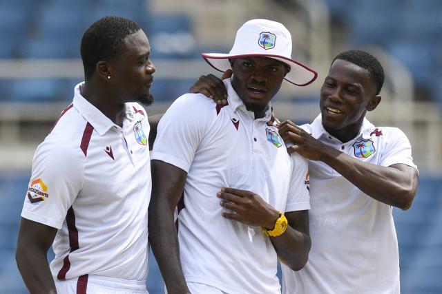 (L/R) Jayden Seales, Alzarri Joseph and Shamar Joseph of West Indies celebrate bowling out Australia during the third day of the third Test cricket match between West Indies and Australia at Sabina Park in Kingston, Jamaica, on July 14, 2025. (Photo by Randy Brooks / AFP)