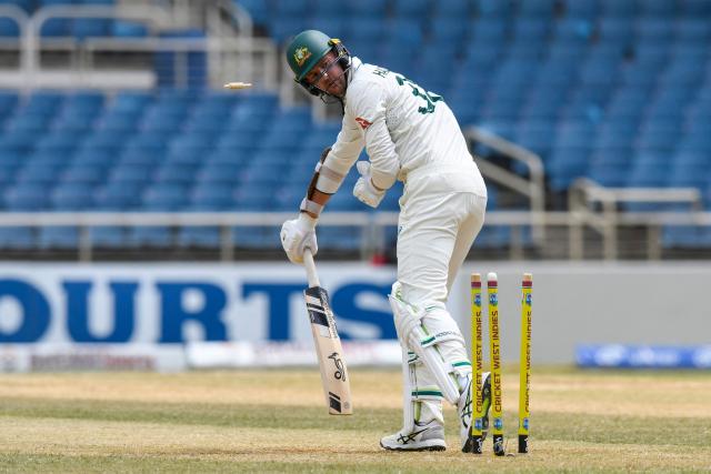 Josh Hazlewood of Australia is bowled by unseen Alzarri Joseph of West Indies during the third day of the third Test cricket match between West Indies and Australia at Sabina Park in Kingston, Jamaica, on July 14, 2025. (Photo by Randy Brooks / AFP)