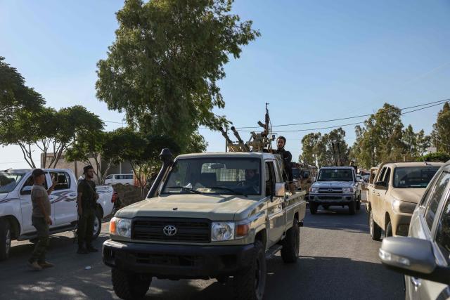 Members of Syria's security forces patrol an area between Mazraa and Walga near the predominantly Druze city of Sweida on July 14, 2025, following clashes between Bedouin tribes and Druze fighters. Negotiations were underway between the authorities and Druze representatives to end deadly sectarian clashes in southern Syria, a major Druze armed group told AFP on July 14, as government forces pressed towards the city of Sweida. (Photo by Bakr ALKASEM / AFP)