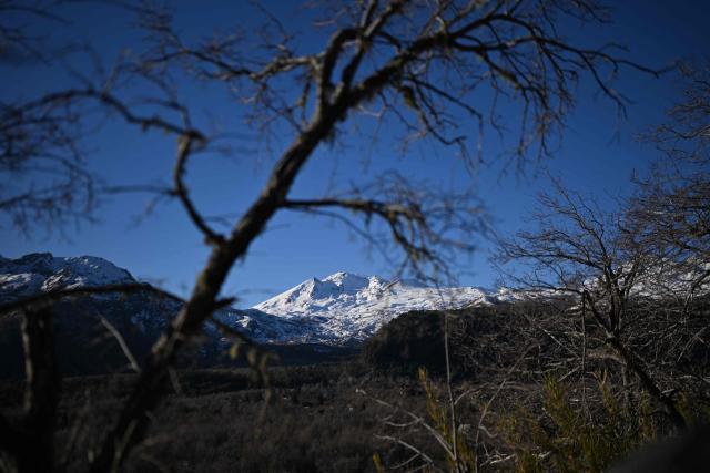 View of the volcanoes Chillan Viejo and Chillan Nuevo, from the town of Las Trancas in the Ñuble region, Chile, on July 9, 2025. (Photo by RODRIGO ARANGUA / AFP)