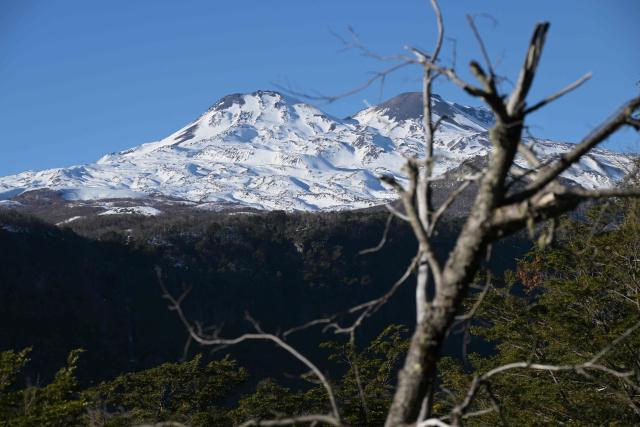 View of the volcanoes Chillan Viejo and Chillan Nuevo, from the town of Las Trancas in the Ñuble region, Chile, on July 9, 2025. (Photo by RODRIGO ARANGUA / AFP)