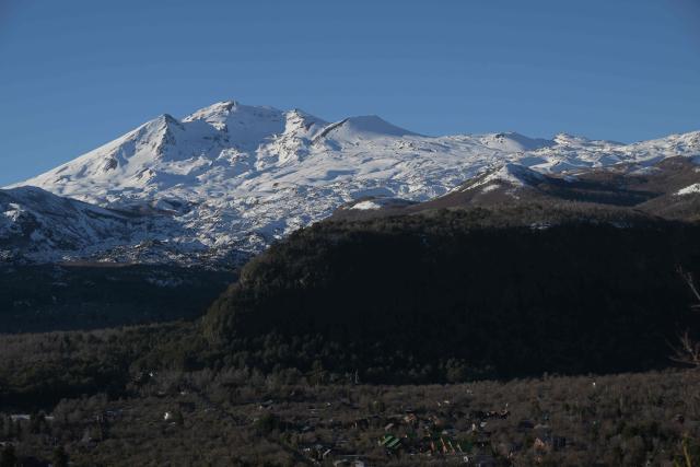 View of the volcanoes Chillan Viejo and Chillan Nuevo, from the town of Las Trancas in the Ñuble region, Chile, on July 9, 2025. (Photo by RODRIGO ARANGUA / AFP)