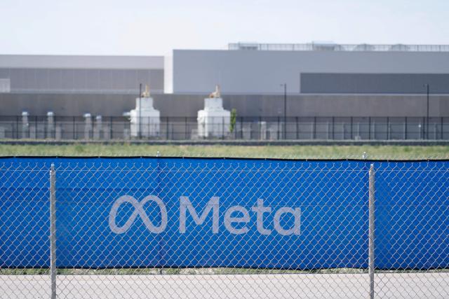 (FILES) Outside view of the newly completed Metas Facebook data center in Eagle Mountain, Utah on July 18, 2024. In a scramble to quickly bring more data centers online, US cloud computing giants are now getting directly involved in energy production. And while they are using some renewable energy options and trying to revive nuclear power, they are also turning to fossil fuels like gas, which in the United States is relatively cheap. A fight in Davis, in the woods of rural West Virginia, is the latest example of the war between the US tech sector -- and its rapidly rising need for energy to power the AI boom -- and the communities it affects. (Photo by GEORGE FREY / AFP)