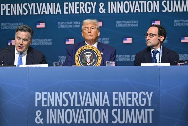 US President Donald Trump (C) sits flanked by US Senator Dave McCormick (R-PA) and CEO of Blackstone Group Jon Gray (R) during the Pennsylvania Energy and Innovation Summit on the campus of Carnegie Mellon University in Pittsburgh, Pennsylvania on July 15, 2025. (Photo by ANDREW CABALLERO-REYNOLDS / AFP)