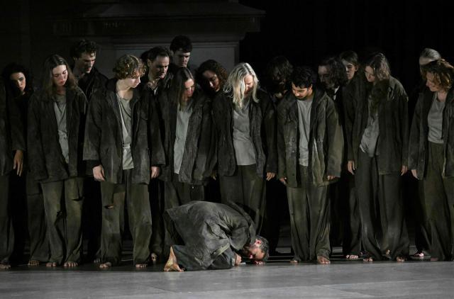Philipp Hochmair (C) performs during the photo rehearsal of the play "Jedermann", at the Salzburg Festival, at Domplatz in Salzburg on July 15, 2025. (Photo by BARBARA GINDL / APA / AFP) / Austria OUT