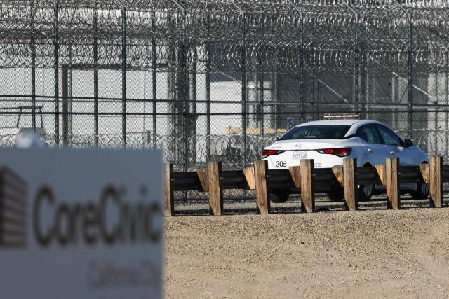 A security vehicle drives around the CoreCivic, Inc. California City Immigration Processing Center in the Kern County desert ahead of the facility reopening as a federal immigrant detention facility under contract with the US Immigration and Customs Enforcement (ICE) in California City, California on July 10, 2025. (Photo by Patrick T. Fallon / AFP)