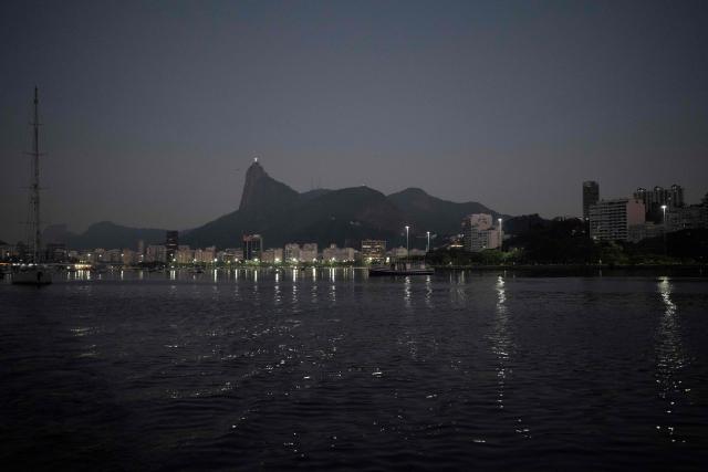 View of the Christ the Redeemer statue taken from the Guanabara Bay in Rio de Janeiro, Brazil on July 15, 2025. (Photo by Pablo PORCIUNCULA / AFP)