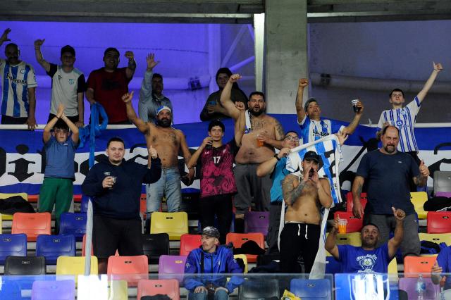 Fans of Cerro Largo cheer for their team during the Copa Sudamericana knockout round play-off football match between Argentina's Central Cordoba and Uruguay's Cerro Largo at the Madre de Ciudades stadium in Santiago del Estero, Argentina on July 15, 2025. (Photo by Eduardo RAPETTI / AFP)
